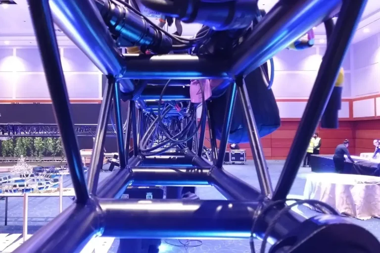 Black truss with a blue light